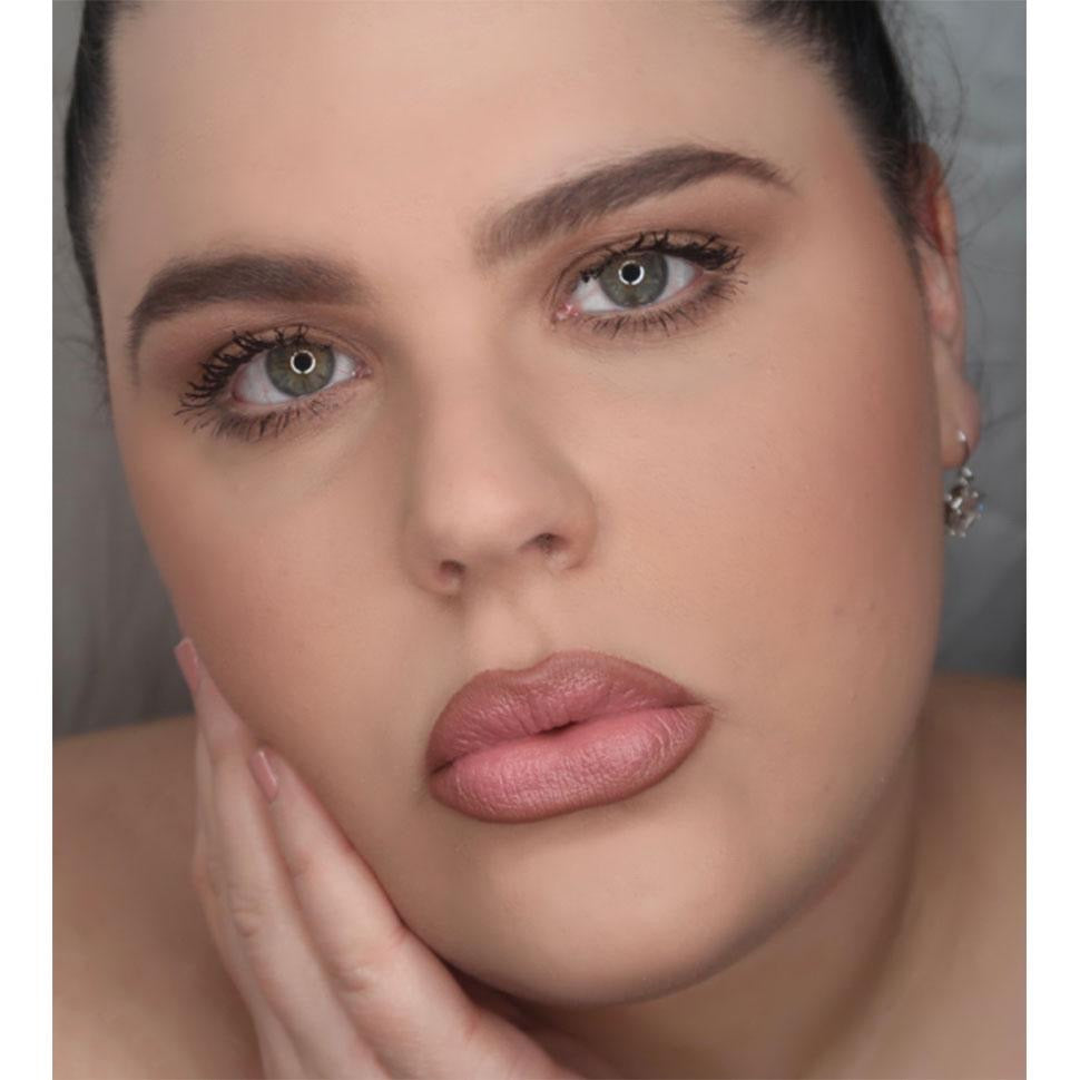 woman wearing pink lipstick